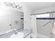 Bathroom with a tub/shower, blue trim and a large mirror over the sink at 13624 Springtide Ct, Orlando, FL 32826