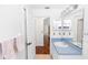 Bathroom with blue trim and a view to another room at 13624 Springtide Ct, Orlando, FL 32826