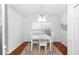 Bright dining room featuring a ceiling fan, modern table with chairs, and lots of light at 13624 Springtide Ct, Orlando, FL 32826