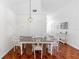 Formal dining area with stylish table, chairs and chandelier at 13624 Springtide Ct, Orlando, FL 32826