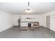 Spacious garage with built in cabinets and countertop work area for projects and storage at 13624 Springtide Ct, Orlando, FL 32826