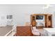 Cozy living room featuring unique flooring, built-in entertainment center and nice natural light at 13624 Springtide Ct, Orlando, FL 32826