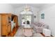 Cozy living room with vaulted ceilings, open access to the screened patio at 13624 Springtide Ct, Orlando, FL 32826