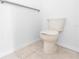 Clean, well-lit powder room with tiled floor and traditional toilet at 13624 Springtide Ct, Orlando, FL 32826