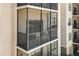Screened in balcony with black railings and a seating area at 14501 Grove Resort Ave # 1441, Winter Garden, FL 34787