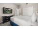 Well-lit bedroom featuring a TV, closet, and comfortable bed with neutral tones at 14501 Grove Resort Ave # 1441, Winter Garden, FL 34787