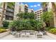 Relaxing courtyard featuring comfortable outdoor seating surrounded by lush tropical landscaping, perfect for community gatherings at 14501 Grove Resort Ave # 1441, Winter Garden, FL 34787