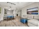 Open-concept living area with comfortable seating, dining space, and modern decor at 14501 Grove Resort Ave # 1441, Winter Garden, FL 34787