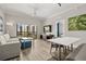 Bright living room with balcony access, comfortable seating, and a modern aesthetic at 14501 Grove Resort Ave # 1441, Winter Garden, FL 34787
