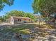Exterior of home featuring backyard, storage shed, and clothesline on a sunny day at 1531 Jefferson Dr, Mount Dora, FL 32757