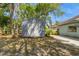 A backyard featuring a shed for storage in addition to the trees and lawn at 212 Hound Run Pl, Casselberry, FL 32707
