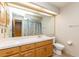 Well lit bathroom with a large mirror above the vanity, a neutral color scheme and tile flooring at 212 Hound Run Pl, Casselberry, FL 32707