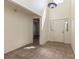 Bright entryway with tiled floors, a high ceiling, and a decorative light fixture creating a welcoming atmosphere at 212 Hound Run Pl, Casselberry, FL 32707
