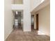 Hallway with high ceilings, tiled floors, and an abundance of natural light streaming in from multiple windows at 212 Hound Run Pl, Casselberry, FL 32707