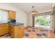 Open breakfast nook with terracotta tiled flooring and a view of the backyard at 212 Hound Run Pl, Casselberry, FL 32707