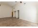 Minimalist living room with high ceilings, tiled floors, and natural light creates a serene and comfortable space at 212 Hound Run Pl, Casselberry, FL 32707