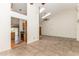 Spacious living room with high ceilings, tile flooring, and easy access to the kitchen creates an open and connected living space at 212 Hound Run Pl, Casselberry, FL 32707