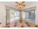 Covered patio includes sliding glass doors and terra cotta tiled flooring at 212 Hound Run Pl, Casselberry, FL 32707