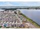 Beautiful lakefront community featuring homes with solar panels, lush green spaces, and water access at 260 Lake Smart Cir, Winter Haven, FL 33881