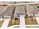 Aerial view of the home with solar panels, showcasing its location in a residential neighborhood at 260 Lake Smart Cir, Winter Haven, FL 33881