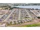 Neighborhood aerial view displaying organized streets, well-maintained homes, and lush surrounding landscape near the water at 260 Lake Smart Cir, Winter Haven, FL 33881