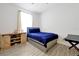 Bedroom with a bed, wooden floors, a window, and a shelf with baseball equipment at 260 Lake Smart Cir, Winter Haven, FL 33881
