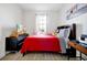 Bedroom with a bed, wooden floors, a window, and a television on a dresser at 260 Lake Smart Cir, Winter Haven, FL 33881