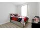 Bedroom with a bed, wooden floors, a window, and a table with board games at 260 Lake Smart Cir, Winter Haven, FL 33881