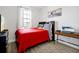Bedroom with a bed, wooden floors, a window, and a desk with a printer at 260 Lake Smart Cir, Winter Haven, FL 33881