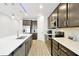 Modern kitchen with stainless steel appliances, a large island, and sleek cabinetry at 260 Lake Smart Cir, Winter Haven, FL 33881