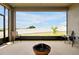 Screened patio features an outdoor fire pit and views of the fenced backyard and lake at 260 Lake Smart Cir, Winter Haven, FL 33881