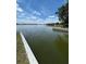Picturesque view of the lake with a clear blue sky, showing the tranquil water and distant shoreline at 260 Lake Smart Cir, Winter Haven, FL 33881