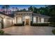 Stunning single-story home with a brick driveway and meticulously maintained landscaping at 3400 Oakmont Ter, Longwood, FL 32779