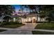 Beautiful one-story home with lush landscaping, and a large brick driveway and two-car garage at 3400 Oakmont Ter, Longwood, FL 32779
