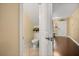 Toilet room with tile flooring and view of the main entry hallway at 5000 Ashford Falls Ln, Oviedo, FL 32765