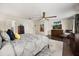 Main bedroom with hardwood floors, comfortable bed, TV, and ensuite bathroom at 5000 Ashford Falls Ln, Oviedo, FL 32765