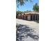 Attached garages with red tile roofs offer covered parking and storage at 5471 Vineland Rd # 7109, Orlando, FL 32811