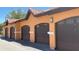 Attached garages feature a red tile roof and provide convenient parking at 5471 Vineland Rd # 7109, Orlando, FL 32811