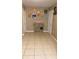 Hallway view featuring tile floors and storage space at 5471 Vineland Rd # 7109, Orlando, FL 32811