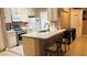 Well-lit kitchen with an eat-in bar, stainless steel appliances and plenty of cabinets at 5471 Vineland Rd # 7109, Orlando, FL 32811