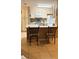 Eat-in kitchen features a breakfast bar and updated stainless steel appliances at 5471 Vineland Rd # 7109, Orlando, FL 32811
