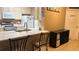 Bright eat-in kitchen with bar seating and stainless steel appliances at 5471 Vineland Rd # 7109, Orlando, FL 32811