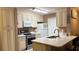 Charming kitchen boasts updated countertops, stainless steel appliances, and lots of storage at 5471 Vineland Rd # 7109, Orlando, FL 32811