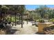 Community picnic area with grilling is surrounded by mature landscaping at 5471 Vineland Rd # 7109, Orlando, FL 32811