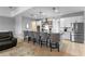 Modern kitchen with stainless steel appliances, granite countertops, and seating at the island at 5981 Sierra Crown St, Mount Dora, FL 32757