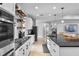 Contemporary kitchen featuring white cabinets, subway tile backsplash, and gas range at 5981 Sierra Crown St, Mount Dora, FL 32757