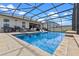 Screened-in pool with an outdoor seating area and tanning ledge at 5981 Sierra Crown St, Mount Dora, FL 32757