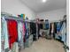 Spacious walk-in closet with ample storage and organization, featuring shelving, hanging rods, and shoe racks at 5981 Sierra Crown St, Mount Dora, FL 32757