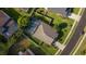 Aerial view of a fenced in home with a pristine lawn and screen enclosed pool at 690 Cascading Creek Ln, Winter Garden, FL 34787