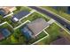 Aerial view of home with screen enclosed pool and fenced in backyard at 690 Cascading Creek Ln, Winter Garden, FL 34787